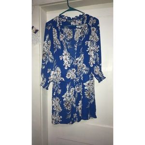 Tropical floral romper with a draw-string waist.